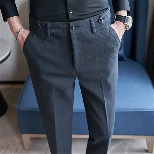Person wearing dark gray pants with a blurred background