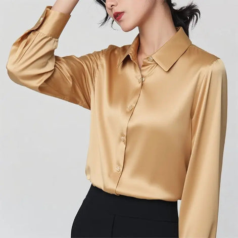 Gold silk shirt worn by a model, shown from the front.