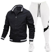 Black jacket and white pants with black accents on a white background