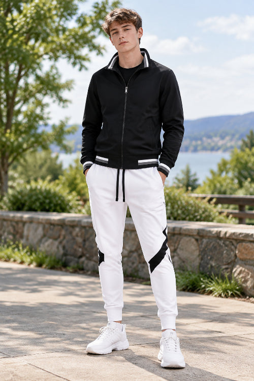 Black jacket and white pants with black accents on a white background