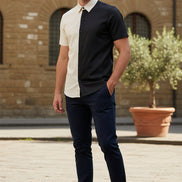 Black and white short-sleeve shirt with button details on a white background