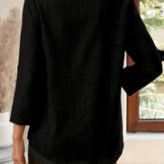 Person wearing a black shirt in an indoor setting