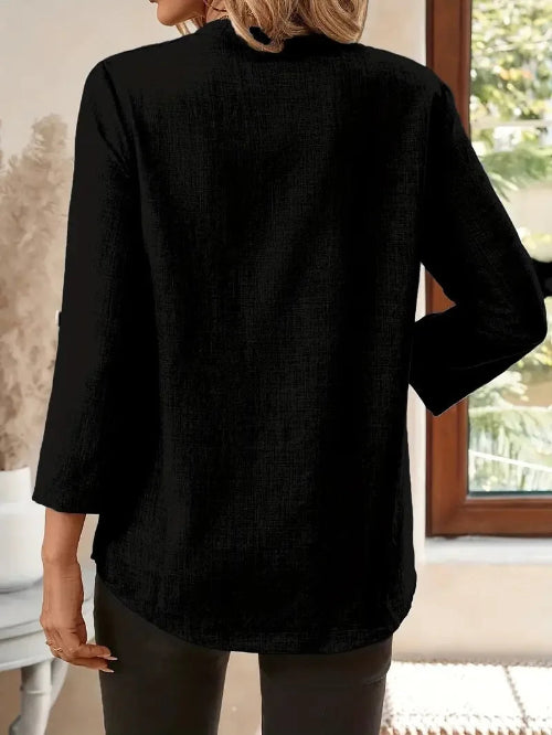 Person wearing a black shirt in an indoor setting