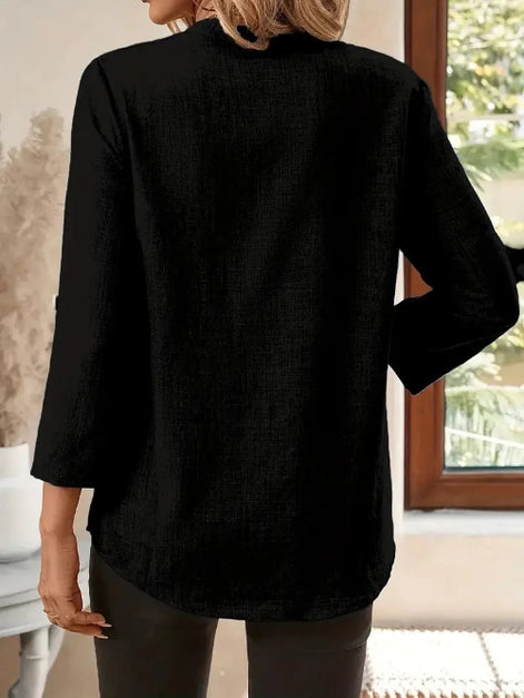 Person wearing a black shirt in an indoor setting