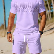 A man wearing a light purple/lavender short-sleeve t-shirt and matching shorts with a white drawstring, 