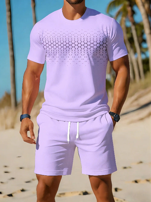 A man wearing a light purple/lavender short-sleeve t-shirt and matching shorts with a white drawstring, 