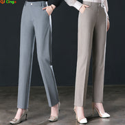 Two models wearing straight-leg office trousers in gray and taupe, paired with heels, against a dark studio background. The QI Cinga logo is visible in the top left corner.