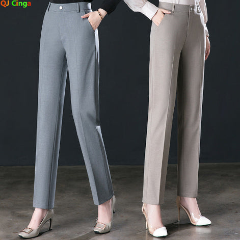 Two models wearing straight-leg office trousers in gray and taupe, paired with heels, against a dark studio background. The QI Cinga logo is visible in the top left corner.