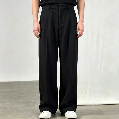 Black wide-leg pleated pants shown on a white background