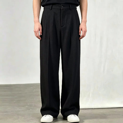 Black wide-leg pleated pants shown on a white background