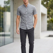 Gray short-sleeve shirt with buttons on a white background
