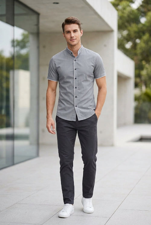 Gray short-sleeve shirt with buttons on a white background