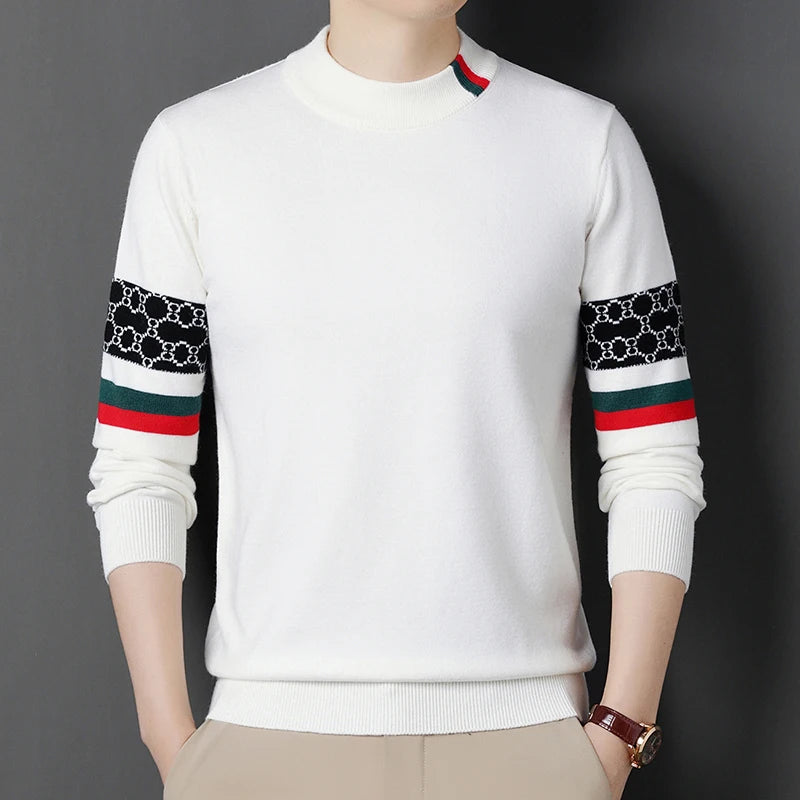 White sweater with patterned sleeves on a dark background