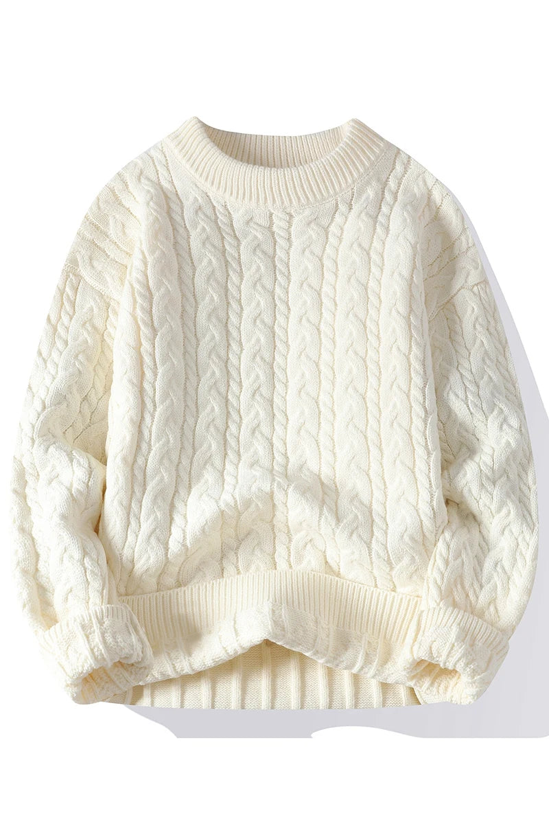 Cream-colored cable knit sweater on a white background