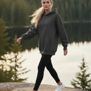 Gray hoodie worn by a person on a white background