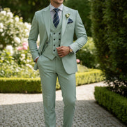 Light green suit with a tie and pocket square on a white background