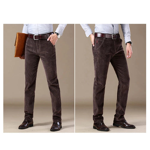Brown corduroy pants worn by a person on a beige background
