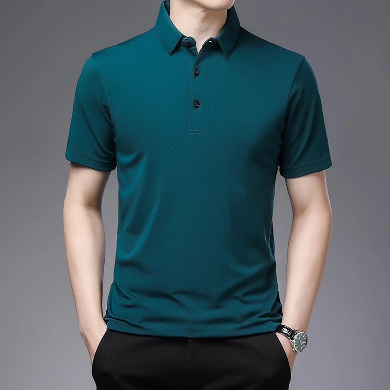 Teal polo shirt worn by a person on a gray background