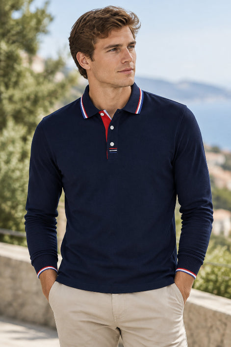 A navy blue long-sleeve polo shirt with a red and white striped collar and matching striped placket 
