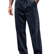 A person wearing dark navy corduroy trousers with a black belt, shown from the waist down against a plain white background.