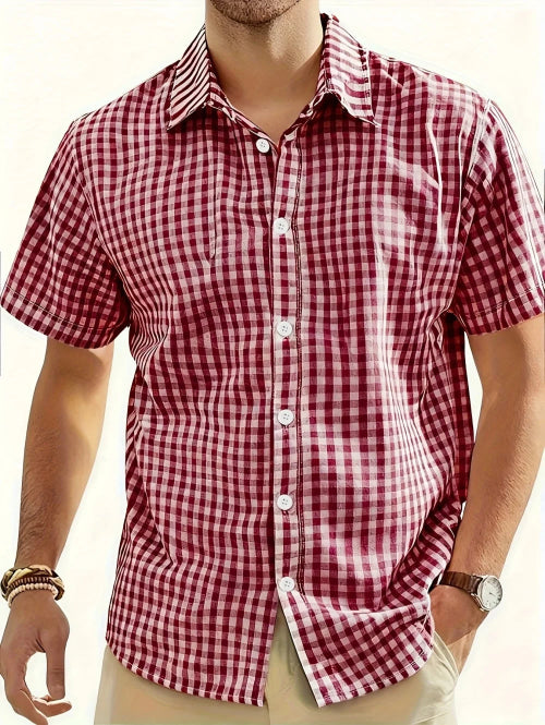 Red and white checkered shirt worn by a person on a plain background