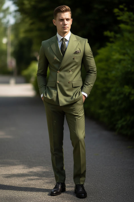 Green suit with a patterned tie and pocket square against a blurred outdoor background