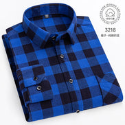 Folded blue and black checkered shirt on a white background with brand logo.
