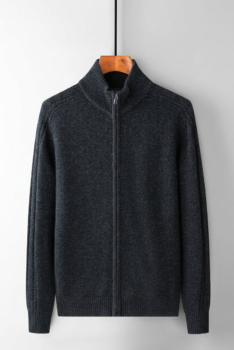 A dark gray zip-up sweater with a mock neck collar, hanging on a wooden hanger against a white background, with Chinese text above describing its features.