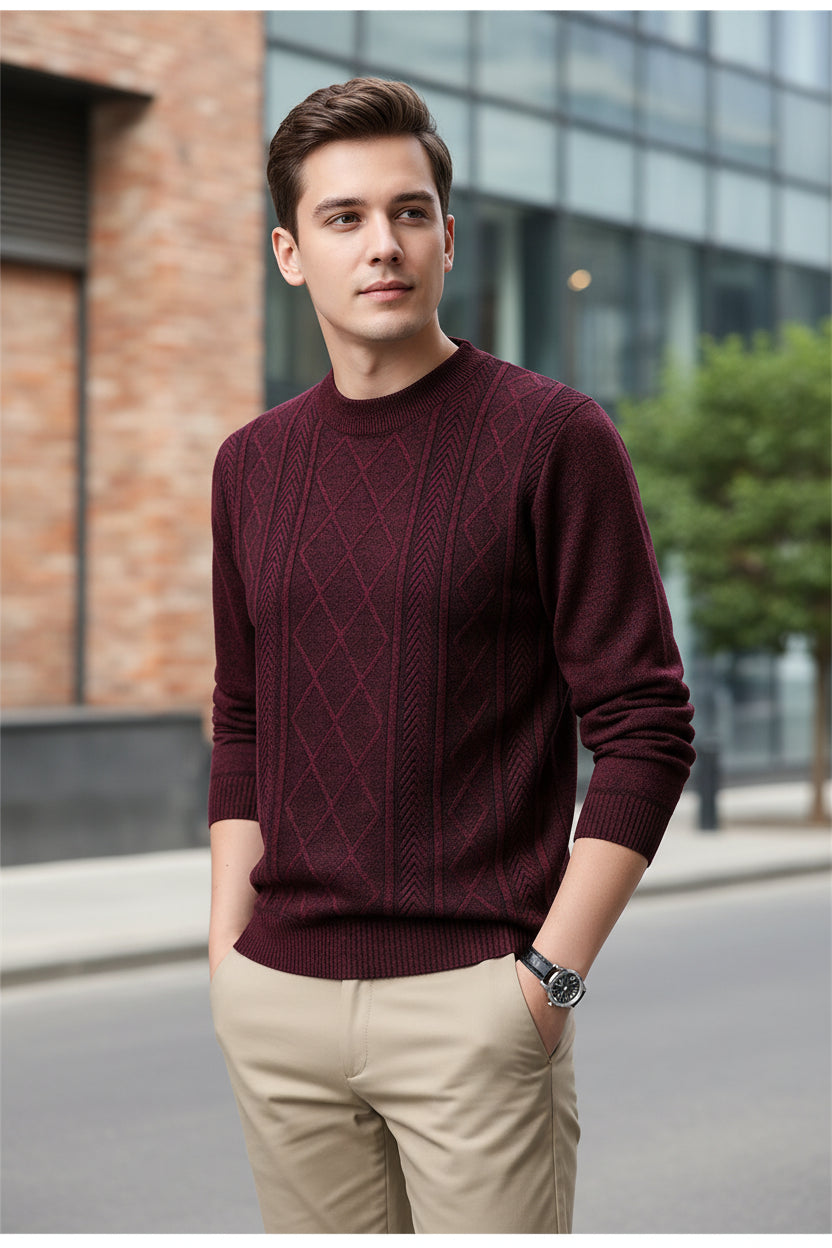 Maroon patterned sweater worn by a person on a gray background