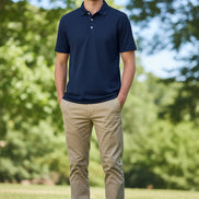 Navy blue polo shirt on a white background