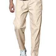 A person wearing light beige relaxed-fit pants, a dark gray ribbed t-shirt, and white sneakers, shown from the waist down against a plain white background.