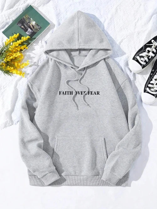 Gray hoodie with 'Faith Over Fear' text on a white background with flowers and books.