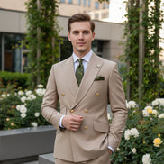 Beige suit with matching jacket and pants on a mannequin, featuring a green tie and pocket square.