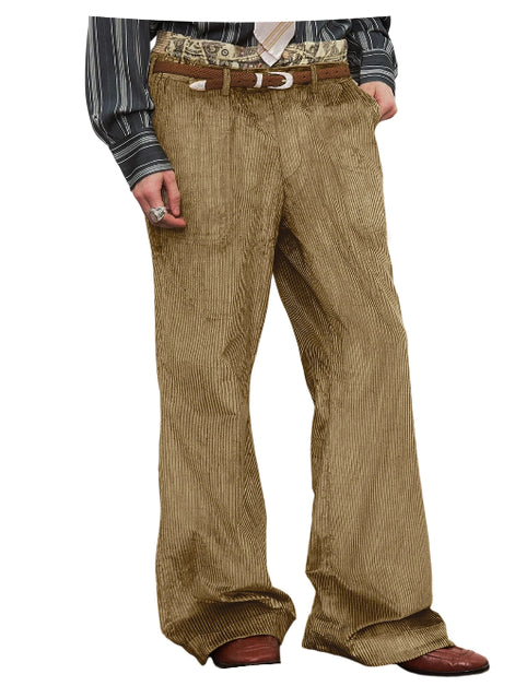 A person wearing wide-leg brown corduroy trousers with a brown belt, a patterned waistcoat, and brown shoes, shown from the waist down on a white background.