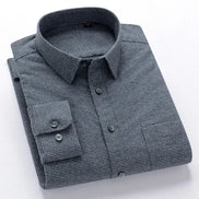 Folded gray checkered shirt on a white background