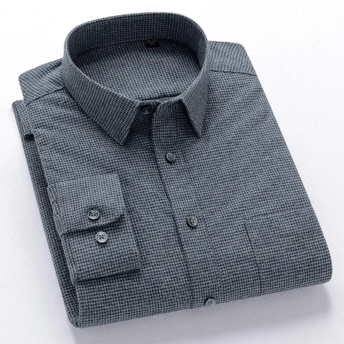Folded gray checkered shirt on a white background