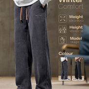 Person wearing dark gray winter pants with brand logo, size and weight information displayed.