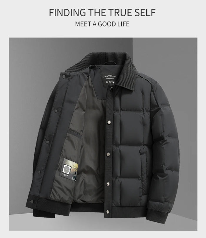 A men's black puffer jacket with a ribbed collar, snap-button front, and ribbed cuffs and hem, displayed against a gray background with promotional text at the top.