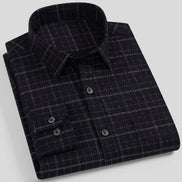 Black checkered shirt with button details on a white background