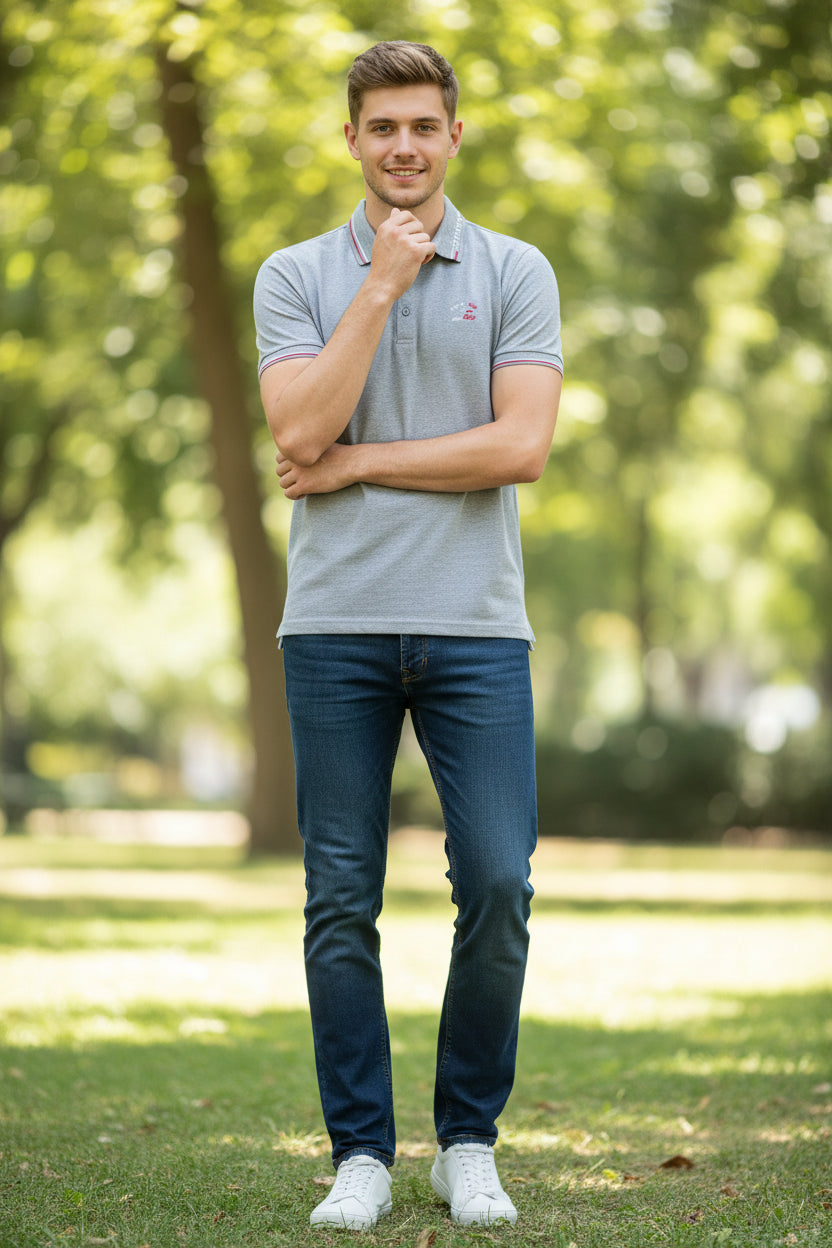 A light gray heathered short-sleeve polo shirt with red and white striped trim on the collar and sleeve cuffs, featuring a small embroidered logo on the left chest. The TACE&SHARK brand logo is visible in the top-left corner.