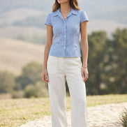 Blue checkered shirt with a collar on a beige background