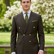 Brown suit jacket with gold buttons and matching pants on a white background