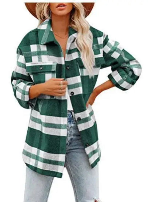 Woman wearing a dark green and white plaid shirt with jeans, against a white background.