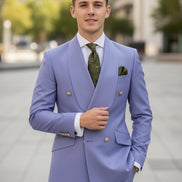 Light purple suit with green tie and pocket square on a white background