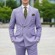 Light purple suit with green tie and pocket square on a white background