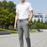 Gray pants with a drawstring waist on a white background