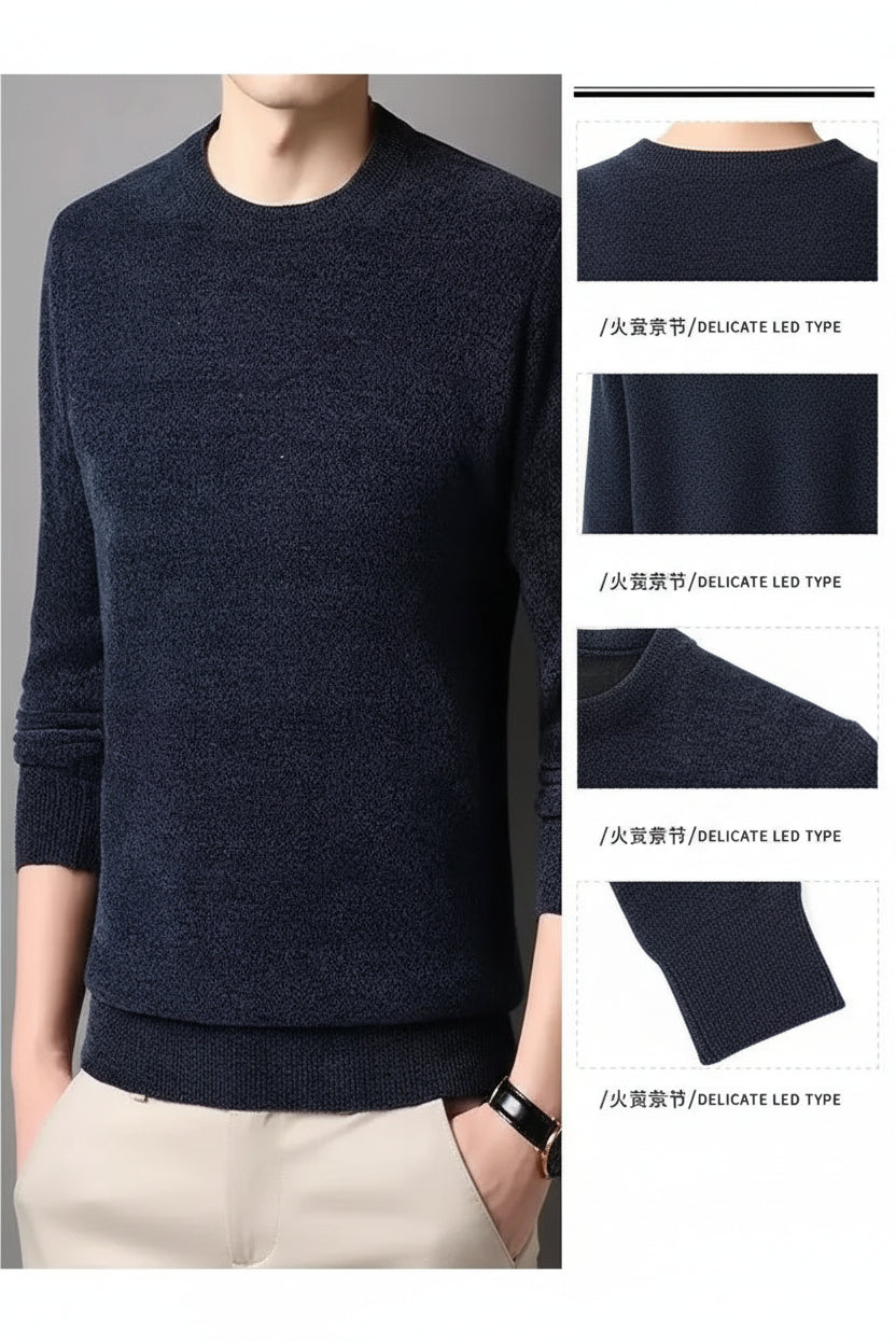 Dark blue sweater worn by a person with close-up details of the fabric.