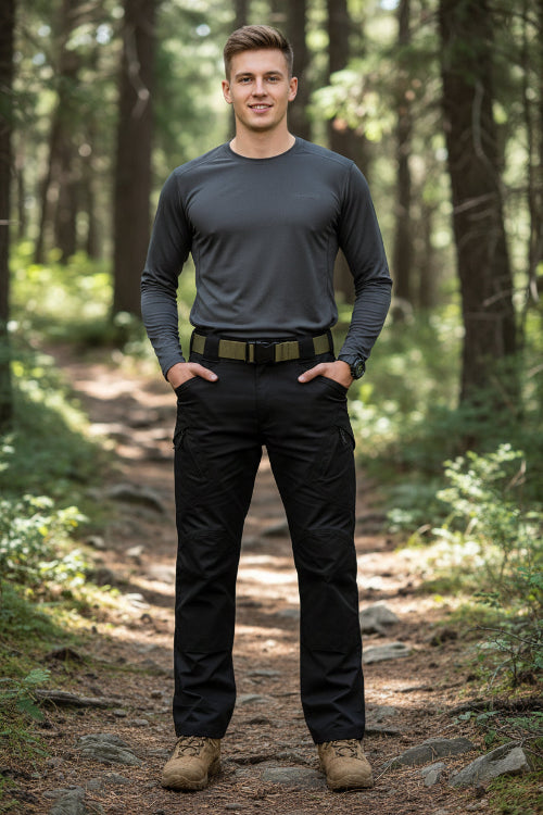 Black tactical pants with a belt on a white background