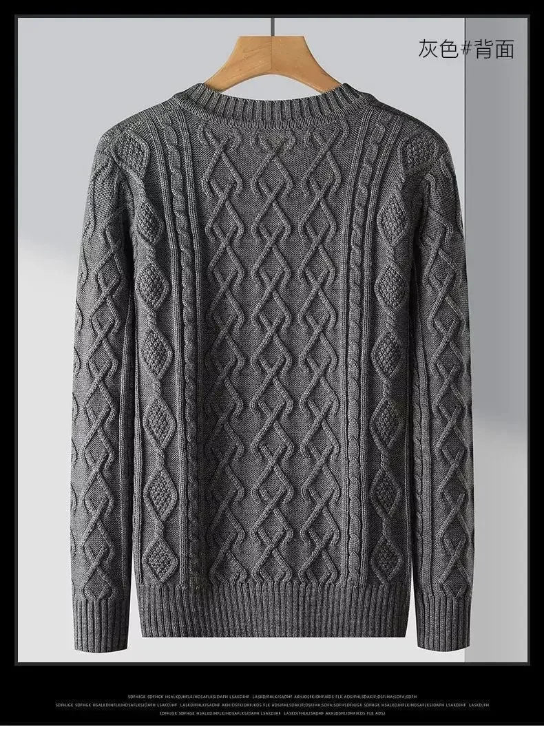 Gray sweater with a diamond pattern on a hanger against a light gray background