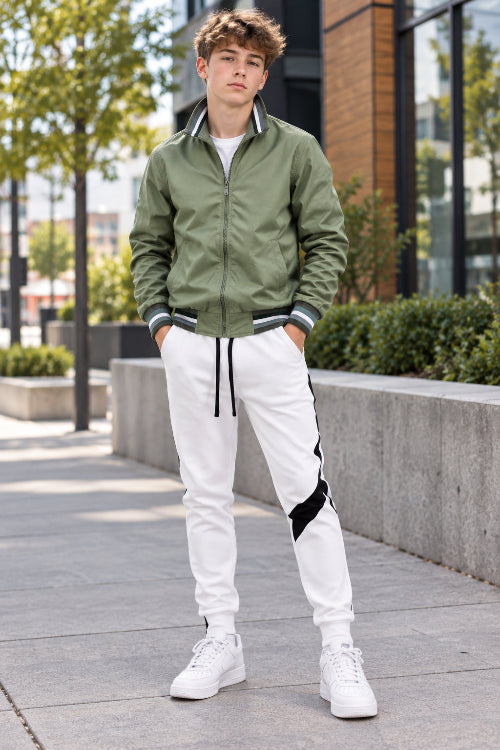 Green jacket and white pants with black accents on a white background